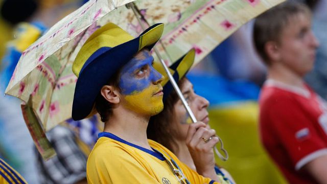 Fans did well to keep their spirits up in the deluge