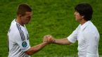 Lukas Podolski shakes hands with Joachim Low, Denmark v Germany, Lviv, Euro 2012, June 17, 2012