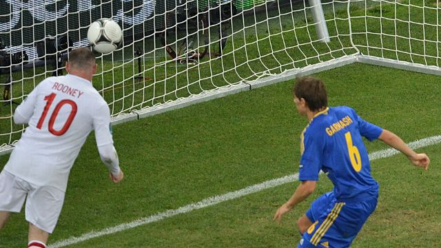 Wayne Rooney heads England into the quarter-finals