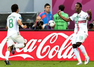 Moutinho celebrates with goalscorer Varela in the late win over Denmark.