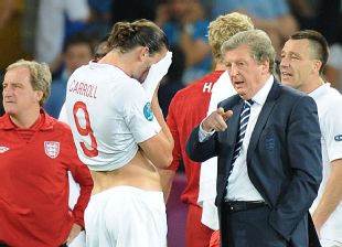 Roy Hodgson consoles his players