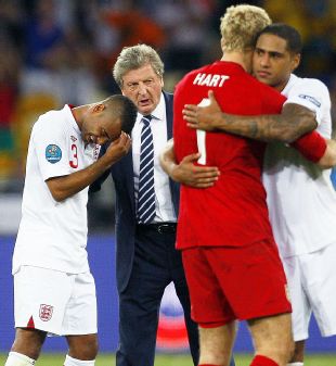 Roy Hodgson consoles his players