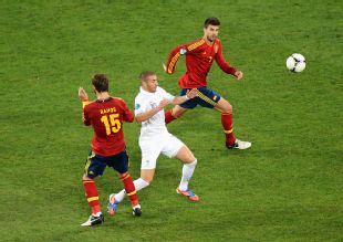 Sergio Ramos and Gerard Pique close down Karim Benzema in the quarter-final