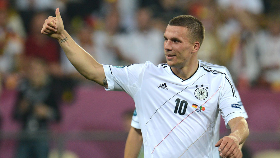 Lukas Podolski celebrates during Germany's win over Portugal