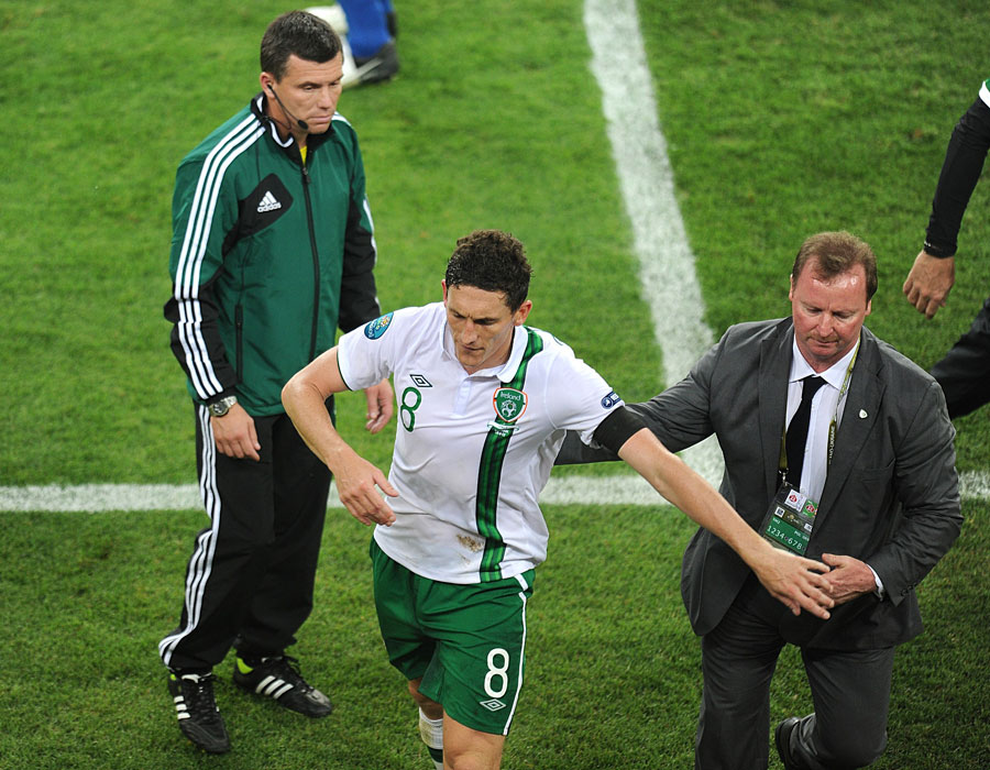 Republic of Ireland's Keith Andrews leaves the field of play after being shown a red card