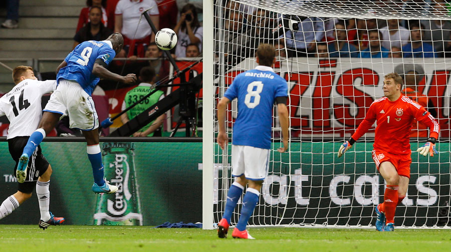Italy's Mario Balotelli scores after a cross from Antonio Cassano