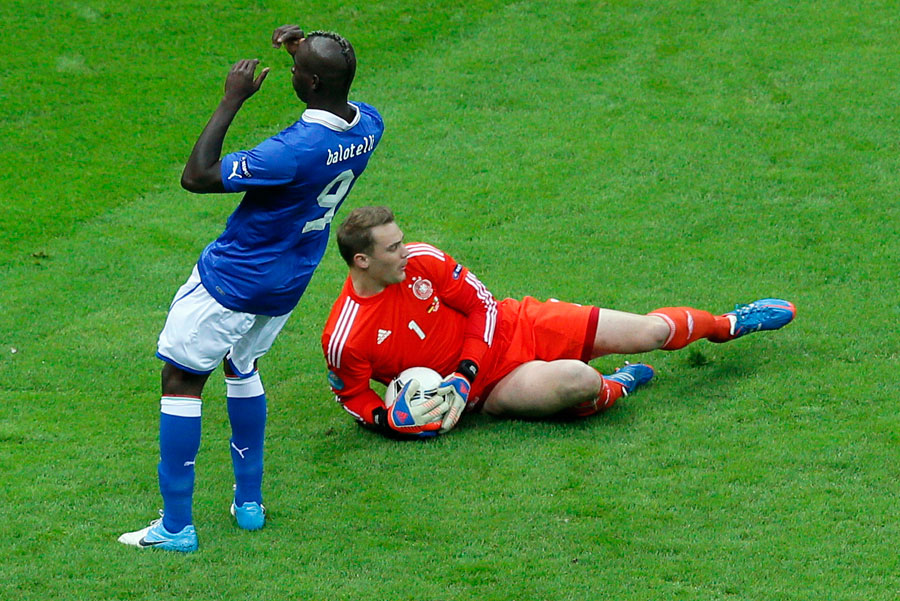 Italy's Mario Balotelli reacts as Germany goalkeeper Manuel Neuer makes a save