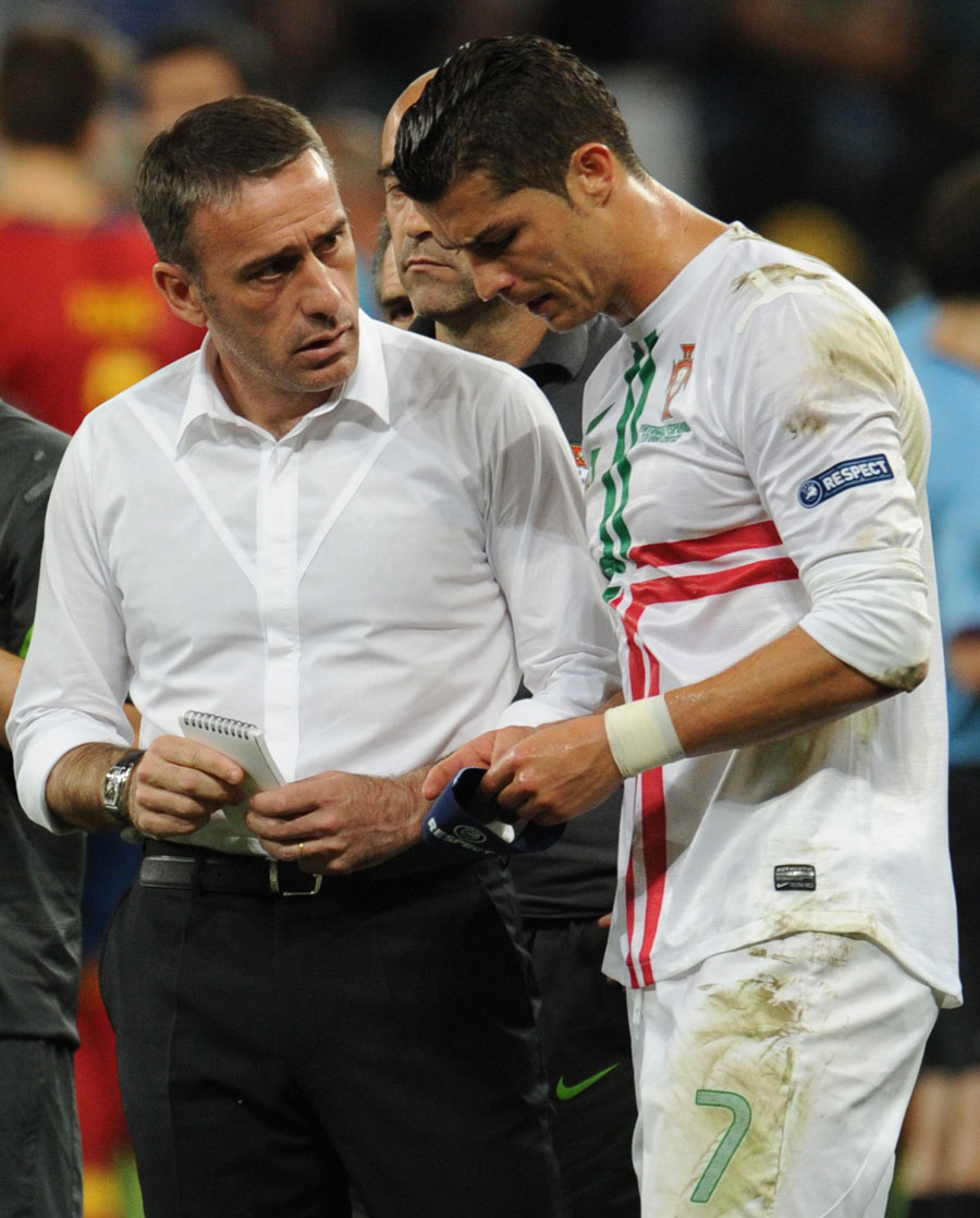Portugal's head coach Paulo Bento talks to Cristiano Ronaldo