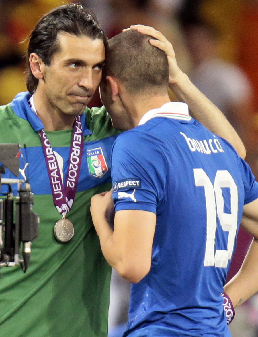 Gianluigi Buffon consoles Leonardo Bonucci after receiving their runners-up medals