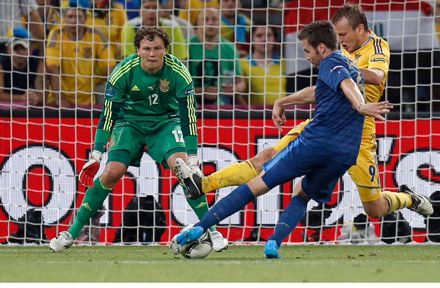 France's Yohan Cabaye scores his team's second goal past Ukraine goalkeeper Andriy Pyatov and Oleh Gusev