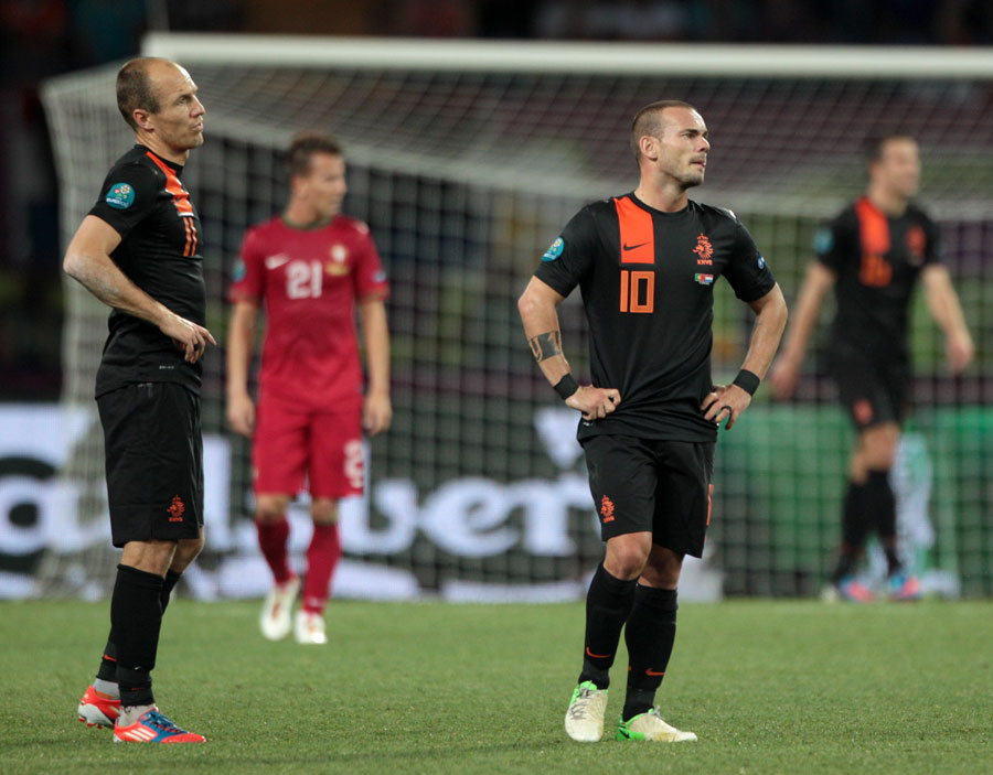 Netherlands' Arjen Robben and Wesley Sneijder appear dejected at the end of the game