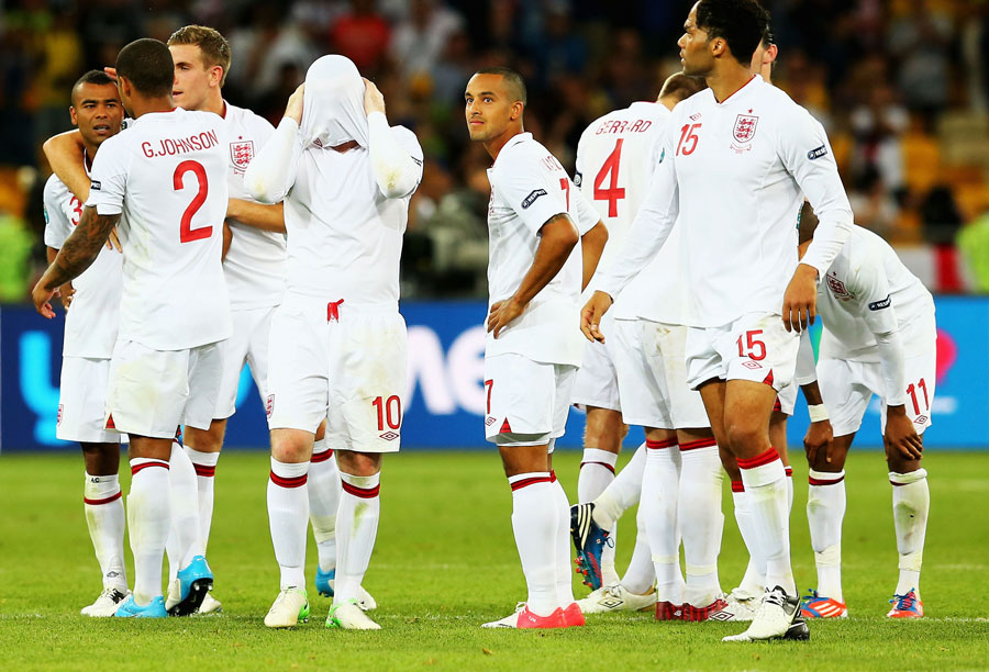 Players of England look dejected after the penalty shootout