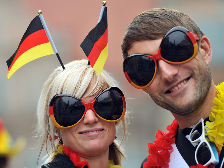 Supporters of Germany wear funny sunglasses in the streets ahead of the match 20120622