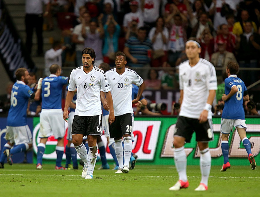 Germany's players react after Mario Balotelli put Italy ahead