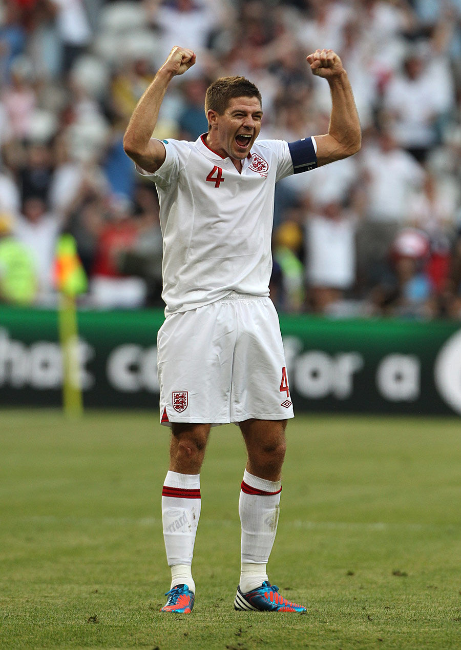 Steven Gerrard talks with Patrice Evra