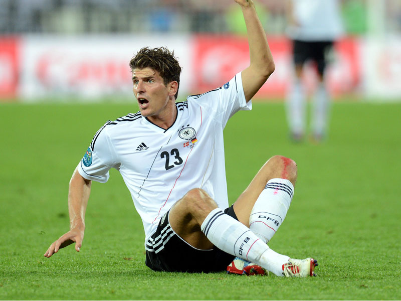 Mario Gomez scores for Germany against Portugal