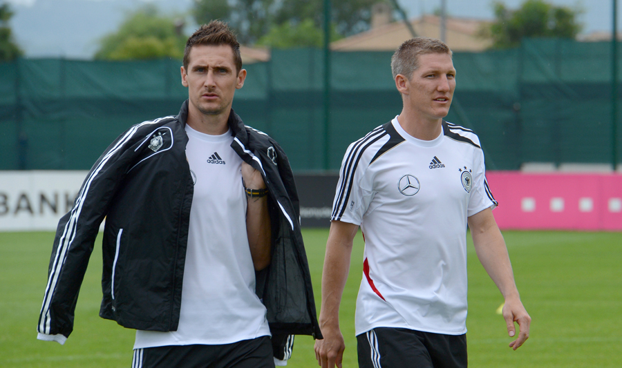 Germany's Miroslav Klose and Bastian Schweinsteiger arrive for a team photo session