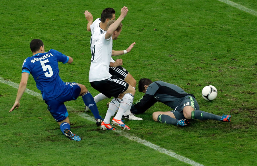 Germany's Miroslav Klose and Andre Schurrle score a disallowed goal past Greece goalkeeper Michalis Sifakis