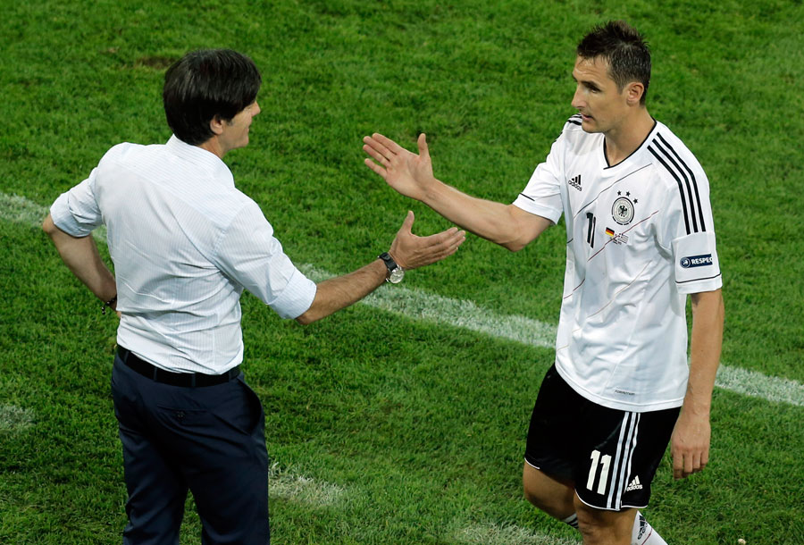 Germany's Miroslav Klose is congratuled by head coach Joachim Low after being substituted