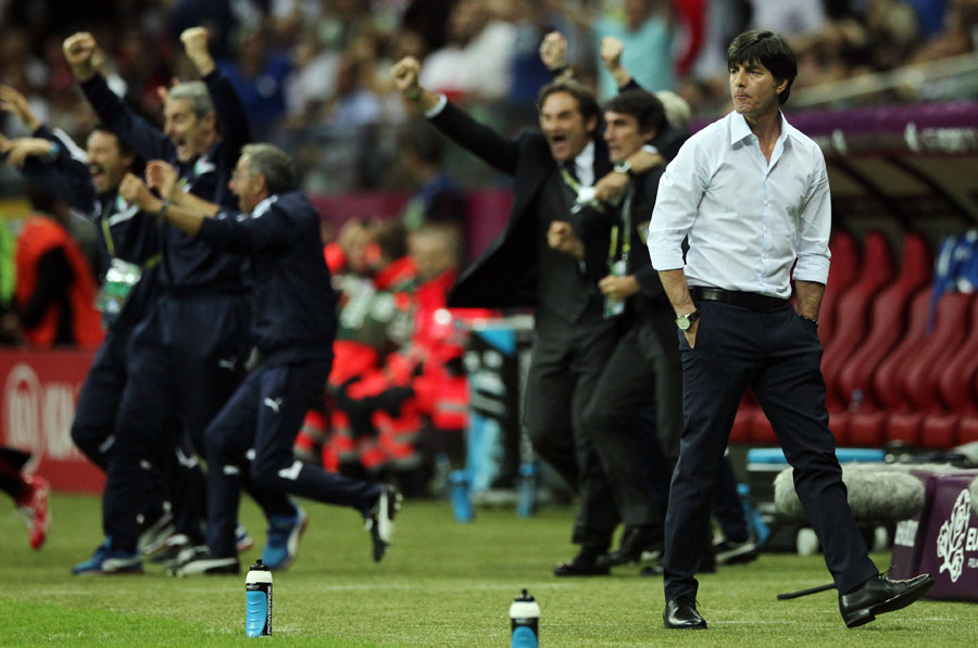 Germany's head coach Joachim Low looks on after Italy scored