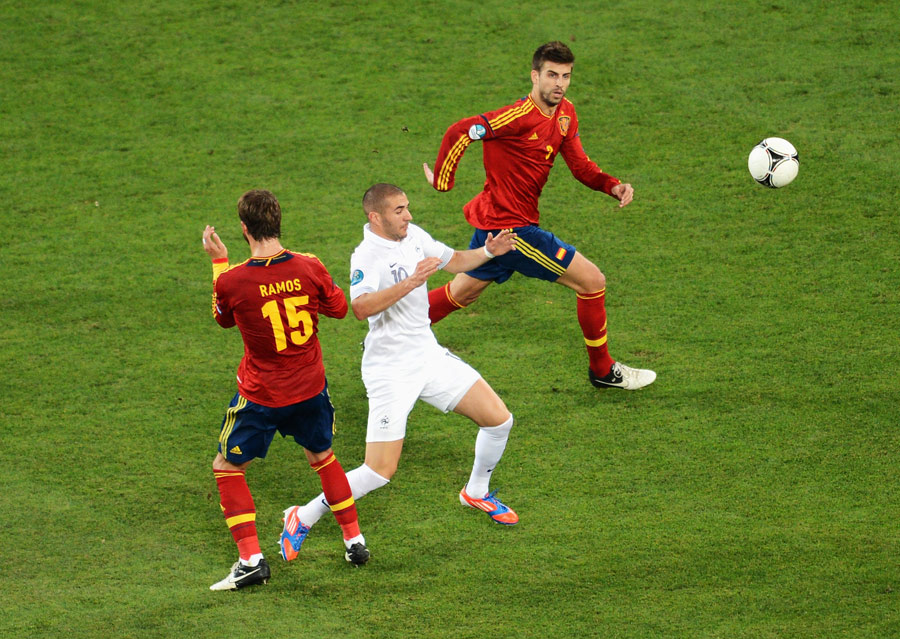 Sergio Ramos and Gerard Pique close in on Karim Benzema