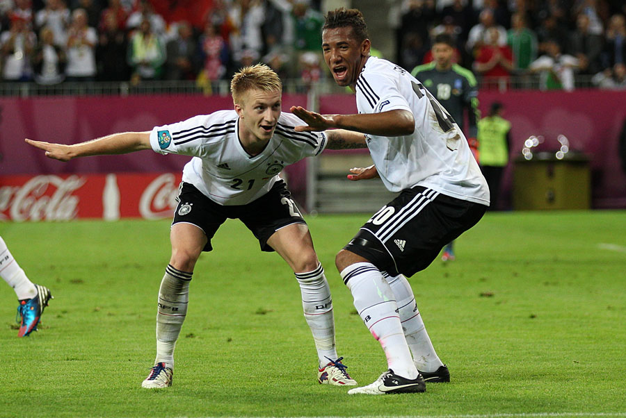 Germany's Marco Reus celebrates scoring his side's fourth goal with Jerome Boateng