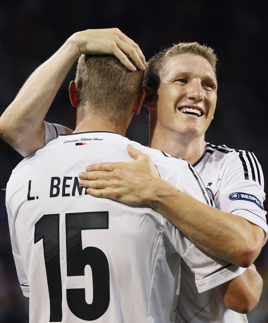 Lars Bender and Bastian Schweinsteiger celebrate victory over Netherlands