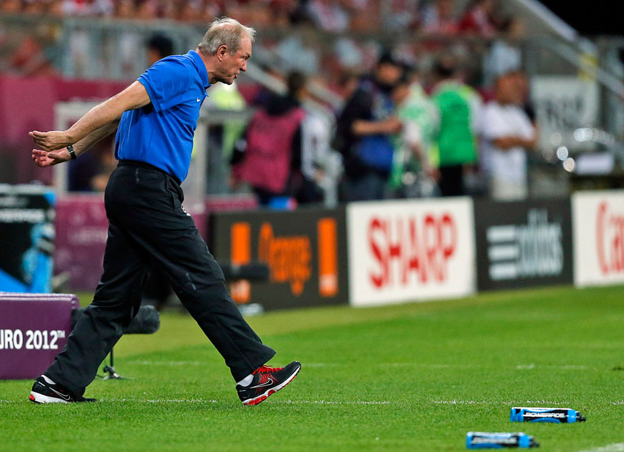 Poland head coach Franciszek Smuda reacts as Poland went out