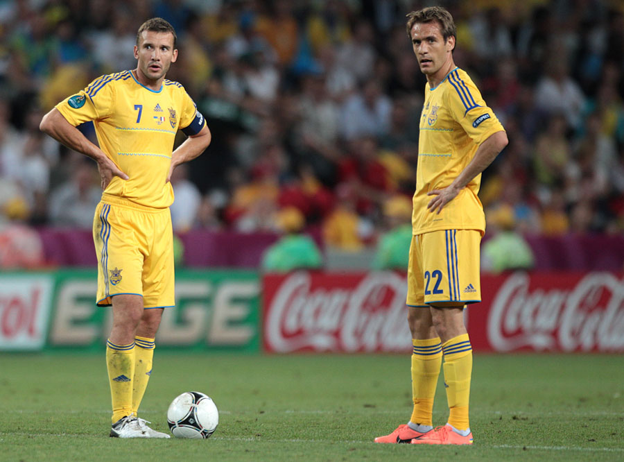 Ukraine's Andriy Shevchenko and Marko Devic wait to restart the game after conceding their first goal