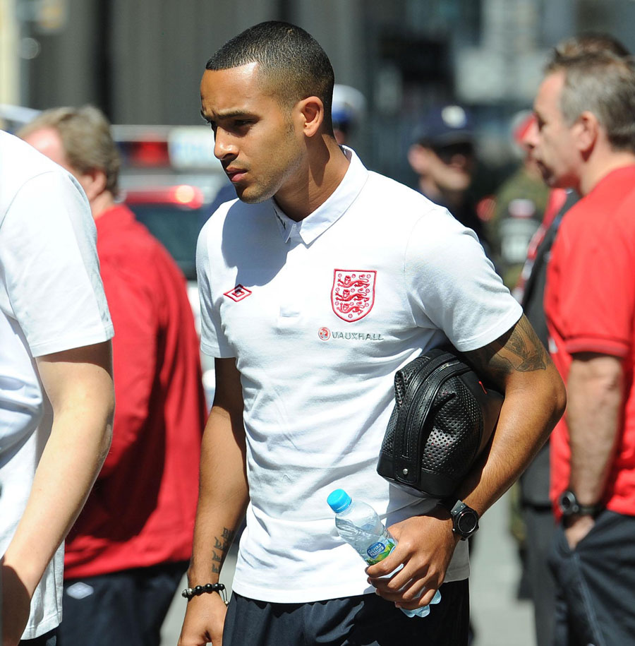 Theo Walcott leaves the team hotel for a training session 
