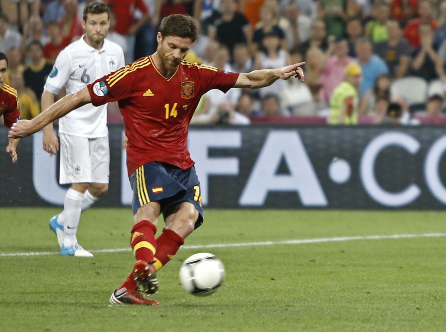 Spain's Xabi Alonso scores a penalty kick for his side's second goal